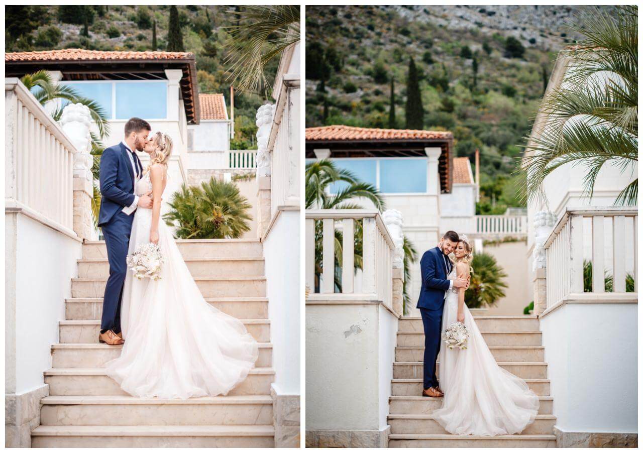 Brautpaar küsst sich auf Treppe mit Schleierkraut Brautstrauß Villa in Kroatien Wedding Kroatien, wedding in croatia,hochzeitsplanerin kroatien, hochzeit in kroatien