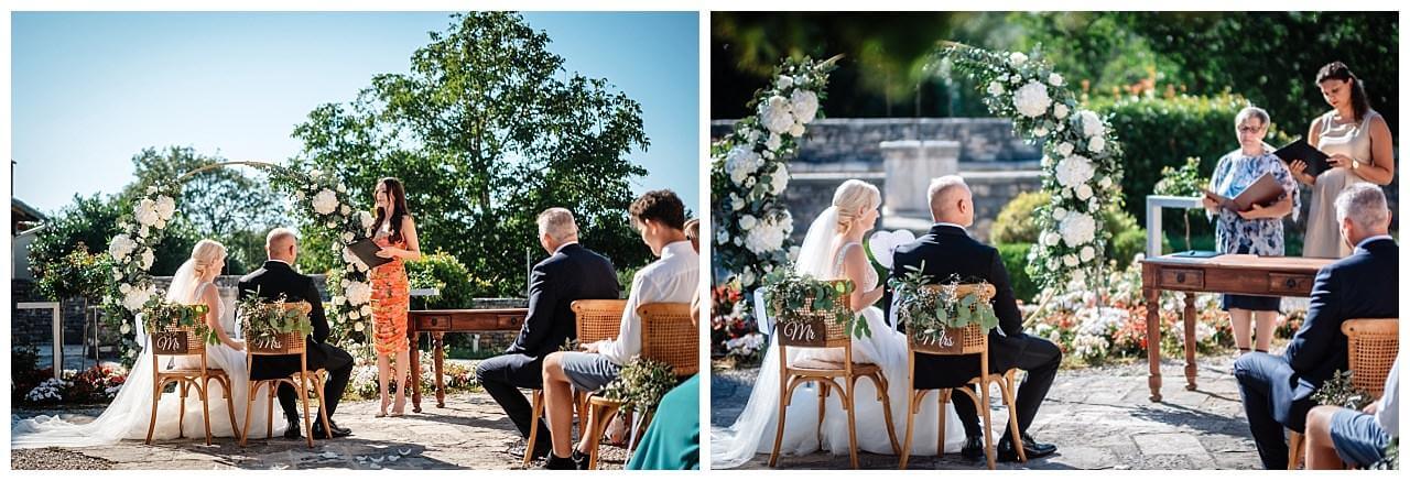 Brautpaar vor Traubogen aus weißen blättern und Rosen bei freier Trauung bei einer Finka in Istrien Kroatien